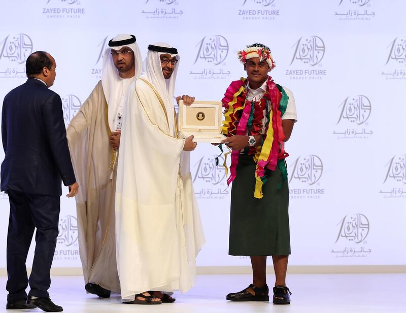 Abu Dhabi, United Arab Emirates - January 15th, 2018: Sheikh Mohammed bin Zayed Al Nahyan presents an award to Motufoua Secondary School (Oceania) at the Sheikh Zayed Future Energy Prize awards ceremony as part of Abu Dhabi Sustainability Week. Monday, January 15th, 2018 at Abu Dhabi National Exhibition Centre (ADNEC), Abu Dhabi. Chris Whiteoak / The National