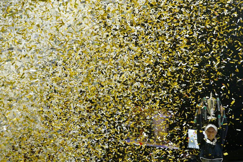 Denmark's Caroline Wozniacki celebrates with the trophy after winning the final against USA's Venus Williams. Edgar Su / Reuters