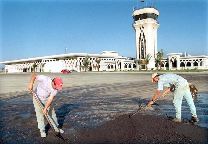October 27, 1998: Palestinians workers asphalt a road at Gaza international airport on the Gaza Strip. The Wye River memorandum signed in Washington by Palestinian Authority President Yasser Arafat and Israeli Premier Benjamin Netanyahu finally clinched a deal to open the airport early November. AFP Photo
