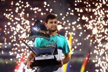 DUBAI, UNITED ARAB EMIRATES - MARCH 20: Aslan Karatsev of Russia poses with the trophy after beating Lloyd Harris of South Africa to win the men's singles Final match during day fourteen of the Dubai Duty Free Tennis at Dubai Duty Free Tennis Stadium on March 20, 2021 in Dubai, United Arab Emirates. (Photo by Francois Nel/Getty Images)