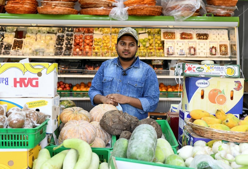 Residents and Heat in Sweihan-AD  Abdullah Ok, 21 from India, owner of Red Apple Fruits and Vegetables Sales in Sweihan, on June 9, 2021.
Reporter: Haneen Dajani News