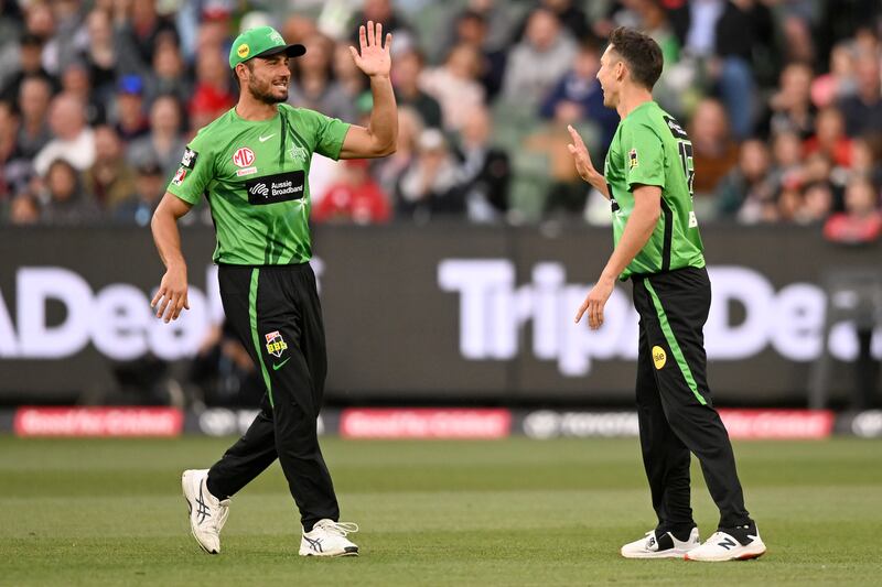 Marcus Stoinis, left, and Trent Boult of Melbourne Stars celebrate the wicket of Aaron Finch of the Melbourne Renegades in the Big Bash League. Getty 