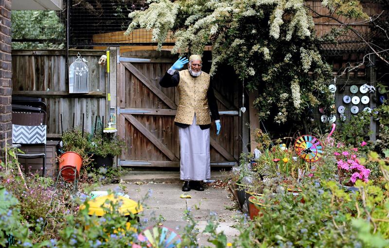 LONDON, UNITED KINGDOM - MAY 23: 100-year-old Dabirul Islam Choudhury walks laps of his communal garden in Bow, east London, United Kingdom on May 23, 2020, while still fasting during Ramadan as he is raising money for the Ramadan Family Commitment (RFC) Covid-19 Crisis Initiative, which funds will be distributed for those affected by the virus in the UK and Bangladesh. Inspired by British Second World War veteran Captain Tom Moore, the 100-year-old began walking 100 laps of the 80-metre garden on April 26 to raise Ã‚Â£1,000. Today funds has reached over Ã‚Â£200,000 (over $243,000). (Photo by Isabel Infantes /Anadolu Agency via Getty Images)
