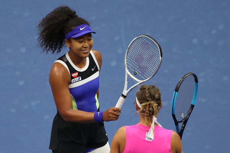 NEW YORK, NEW YORK - SEPTEMBER 12: (L-R) Naomi Osaka of Japan taps rackets at center court with Victoria Azarenka of Belarus after winning her Women's Singles final match on Day Thirteen of the 2020 US Open at the USTA Billie Jean King National Tennis Center on September 12, 2020 in the Queens borough of New York City.   Matthew Stockman/Getty Images/AFP (Photo by MATTHEW STOCKMAN / GETTY IMAGES NORTH AMERICA / AFP)