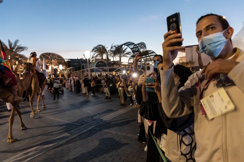 Expo visitors try to make memories of an extraordinary day.