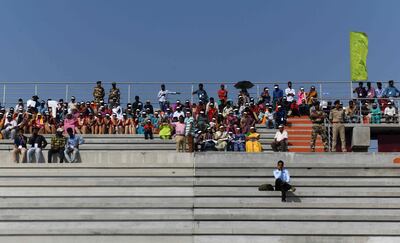 People gather to watch the Indian Space Research Organisation's (ISRO) Polar Satellite Launch Vehicle (PSLV-C45) launching India's Electromagnetic Spectrum Measurement satellite 'EMISAT' -- along with 28 satellites from other countries including Lithuania, Spain, Switzerland and the US -- at the Satish Dhawan Space Centre in Sriharikota, in Andhra Pradesh state, on April 1, 2019. / AFP / ARUN SANKAR
