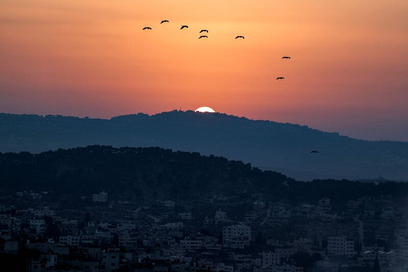 The sun sets after a violent day. AFP