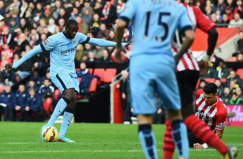 Yaya Toure of Manchester City, left, scores their first goal during the Barclays Premier League match between Southampton and Manchester City at St Mary’s Stadium on November 30, 2014 in Southampton, England.  (Photo by Shaun Botterill/Getty Images)