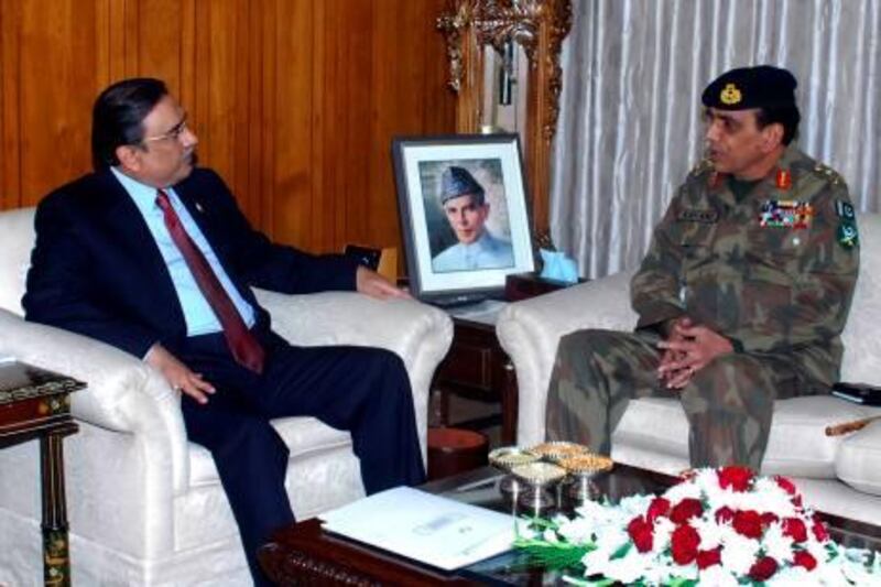 This handout photograph released by Pakistan Press Information Department on December 16, 2009, shows Pakistani Army Chief General Ashfaq Kayani (R) talks with Pakistan’s President Asif Ali Zardari in Islamabad. Pakistan's Supreme Court invalidated an amnesty shielding senior government figures from prosecution, opening the door for corruption cases to be brought against the president's allies. AFP PHOTO/HO/Press Information Department -----RESTRICTED TO EDITORIAL USE---