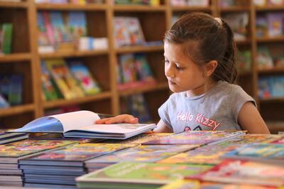 Child visiting a Tamer institute book fair in Gaza. 