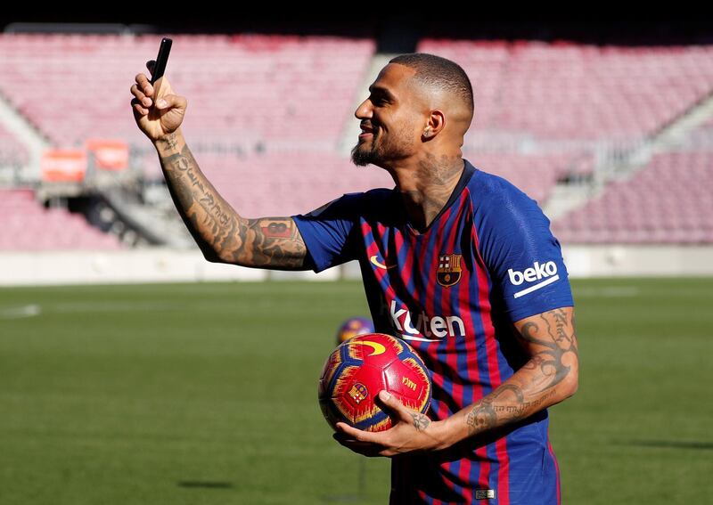 Kevin-Prince Boateng takes a selfie during his official unveiling as a new Barcelona player at Camp Nou. Reuters