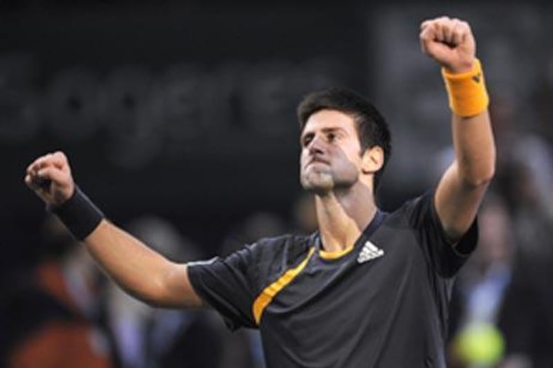 Novak Djokovic roars his delight after beating Gael Monfils in the final of the Paris Masters.