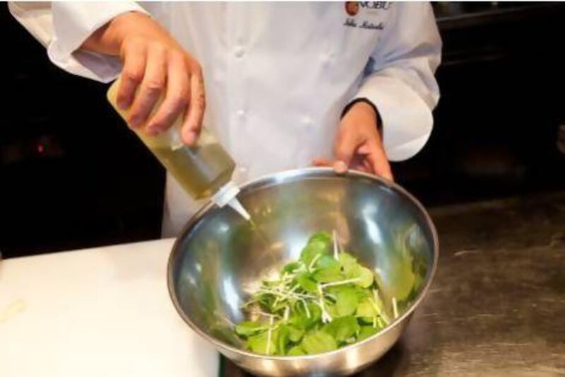Step two, add the olive oil and truffle oil to the leaves. Jaime Puebla / The National