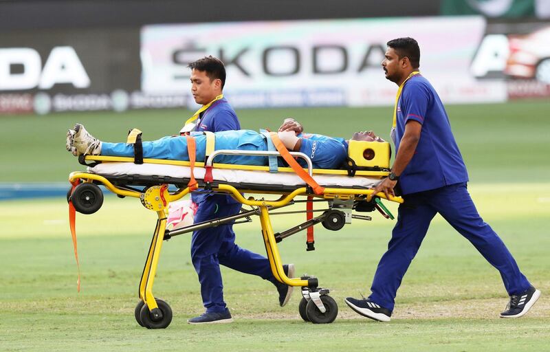 DUBAI , UNITED ARAB EMIRATES, September 19 , 2018 :- Hardik Pandya , bowler of India got injured and taken out of the stadium on the stretcher during the Asia Cup UAE 2018 cricket match between Pakistan vs India held at Dubai International Cricket Stadium in Dubai. ( Pawan Singh / The National )  For Sports/Instagram. Story by Paul 