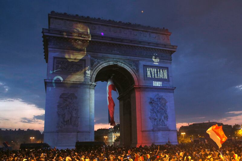 The image of Kylian Mbappe is projected onto the Arc de Triomphe after France won the 2018 World Cup. AP