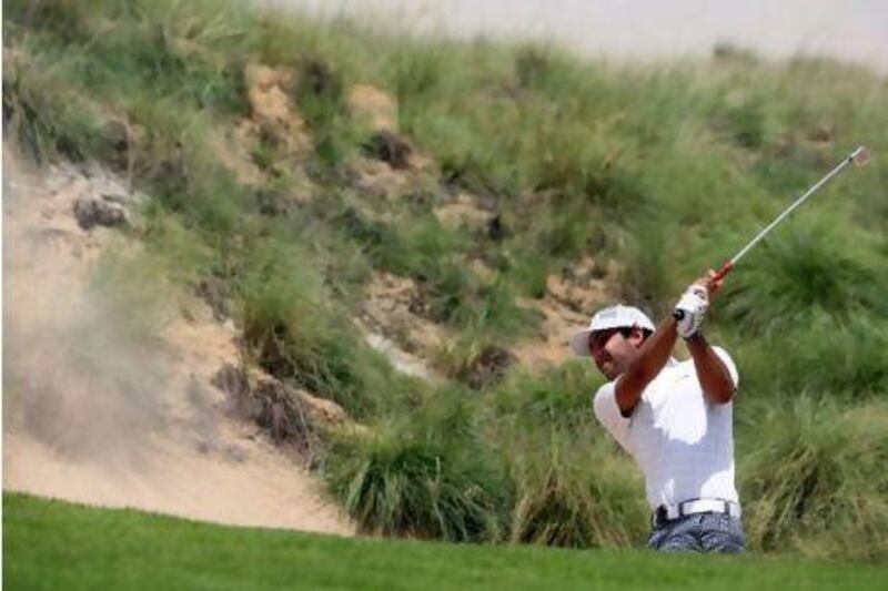 Saif Thabet plays a round of golf at the Yas Links Golf Club to qualify for the Nomura Cup last month.