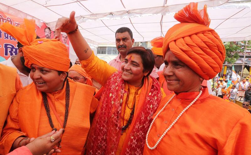 epa07522982 Bhartya Janta Party (BJP) candidate Pragya Singh Thakur or Sadhvi Pragya (C) greets the voters as she takes part in a road show on her way to file her election nominations in Bhopal, India 23 April 2019. Pragya Thakur a Hindu Sannyasin, a nationalist contest against Congress's Digvijaya Singh from Bhopal for the upcoming parliamentary or general elections for India's 545-member lower house of parliament, or Lok Sabha, that is held every five years.Â   EPA/SANJEEV GUPTA