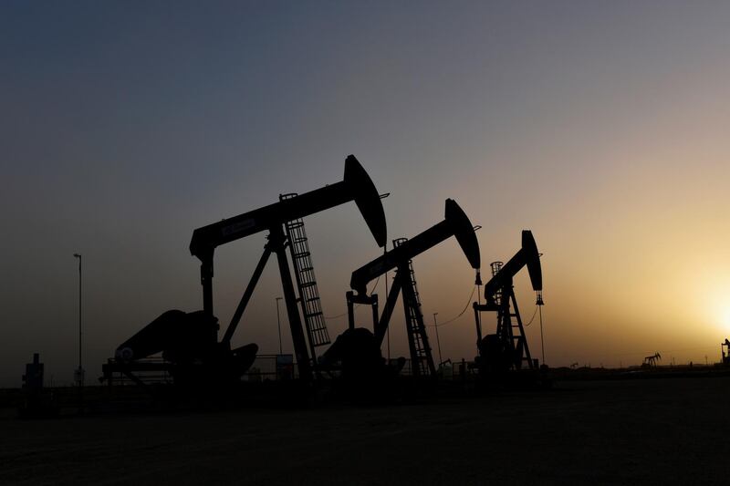 FILE PHOTO: Pump jacks operate at sunset in Midland, Texas, U.S., February 11, 2019. REUTERS/Nick Oxford/File Photo