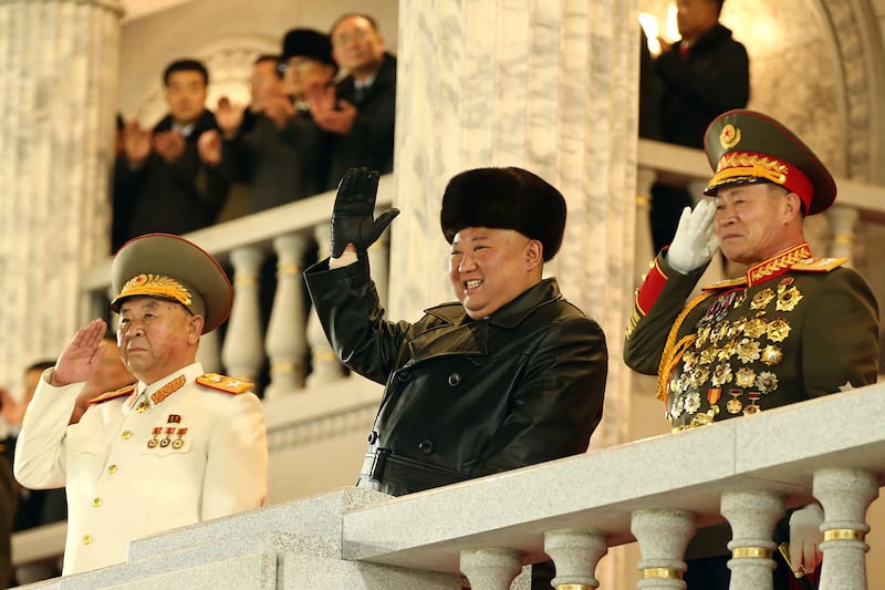 Kim Jong-un is all smiles as he watches the military parade in the North Korean capital Pyongyang. AFP