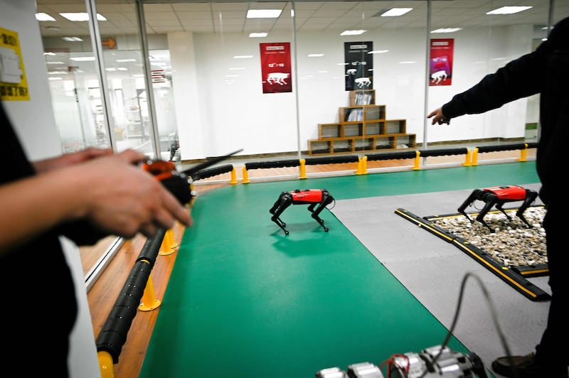 An AlphaDog quadruped robot being remotely controlled in a workshop at the Weilan Intelligent Technology Corporation in Nanjing, China's Jiangsu province. Wang Zhao / AFP