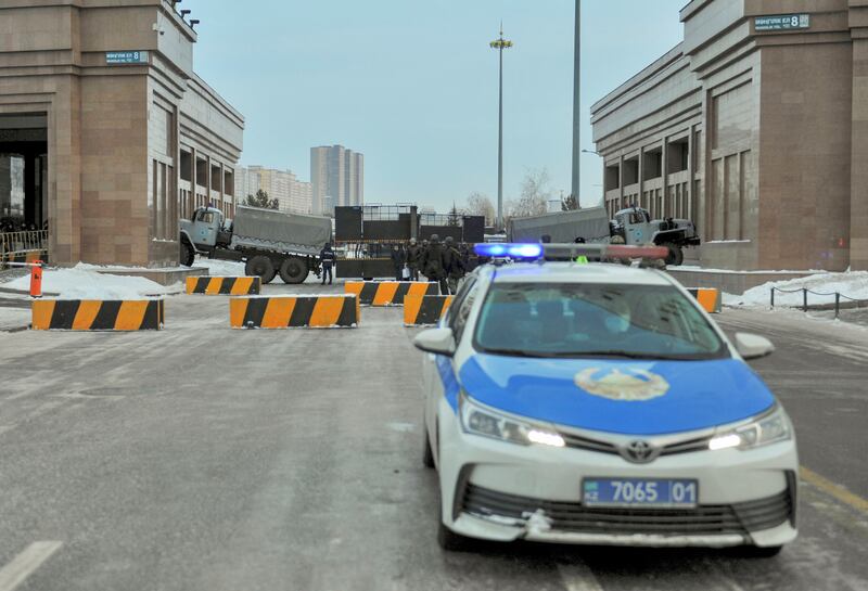 Police block a street leading to the official presidential residence in Kazakhstan's capital Nur-Sultan, after protests against the government. Reuters