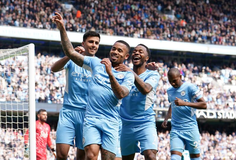 Gabriel Jesus celebrates with teammates after scoring for Manchester City. PA