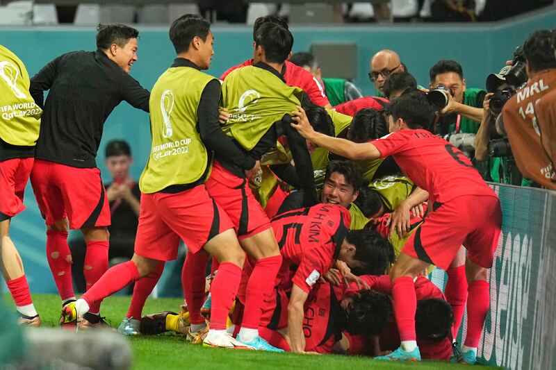 South Korea celebrate after Cho Gue-sung scored his side's second goal. AP