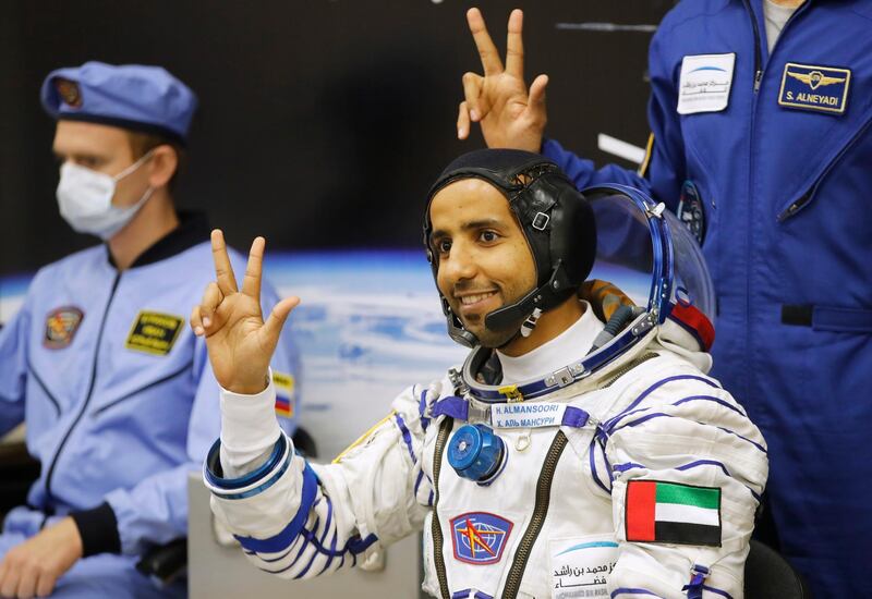 Hazza Al Mansouri throws up the three-fingered hand signal synonymous with Sheikh Mohammed bin Rashid, Vice President and Ruler of Dubai, and that stands for 'winning, victory and love'. Dmitri Lovetsky / AP
