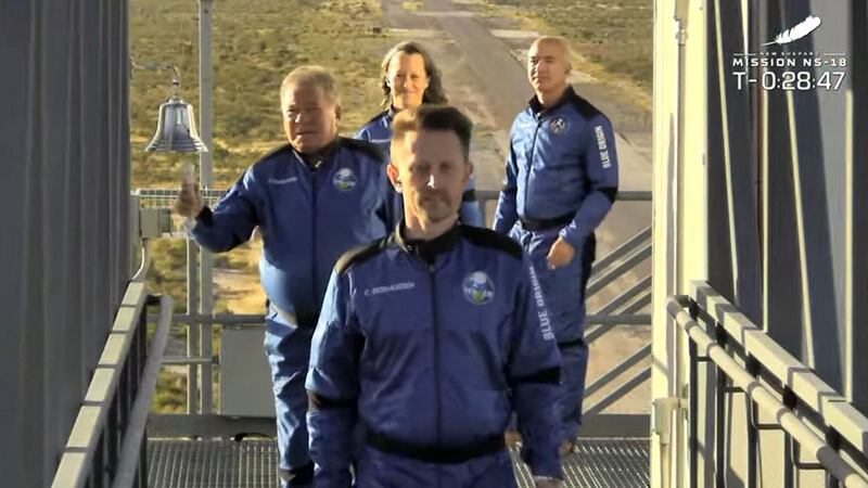 New Shepard NS-18 mission crew member William Shatner rings the bell before lift-off. Accompanying the 'Star Trek' actor are Blue Origin founder Jeff Bezos, in rear, and crew members Chris Boshuizen, front, the co-founder of Planet Labs, and Blue Origin’s vice president of mission and flight operations, Audrey Powers. The fourth member of the crew, who is not pictured, is Medidata Solutions co-founder Glen de Vries. AFP