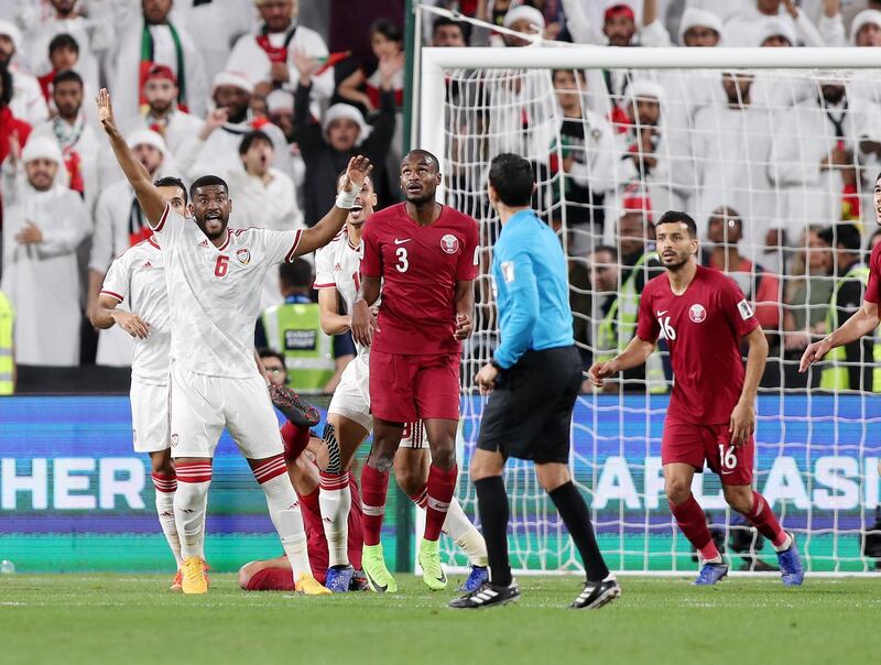 Abu Dhabi, United Arab Emirates - January 29, 2019: The UAE claim hand ball during the semi final between the UAE and Qatar in the Asian Cup 2019. Tuesday, January 29th, 2019 at Mohamed Bin Zayed Stadium Stadium, Abu Dhabi. Chris Whiteoak/The National