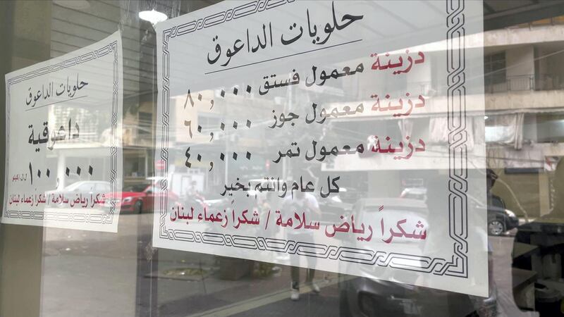 The new prices sheet at the Daouk sweet shop window sarcastically thanking the BDL president and leaders of Lebanon. Mahmoud Rida / The National