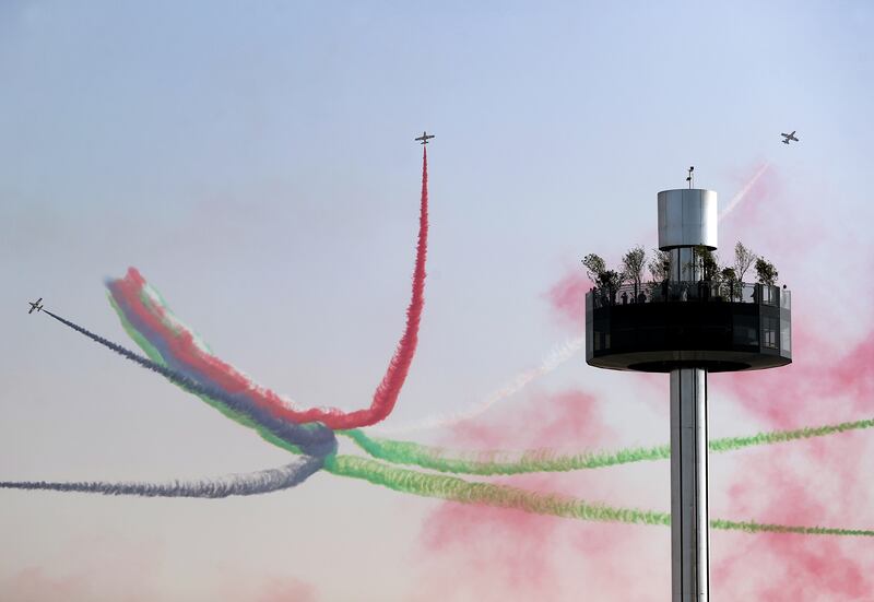 The UAE's Al Fursan aerobatics team perform on the first day of Expo 2020 Dubai. Chris Whiteoak / The National