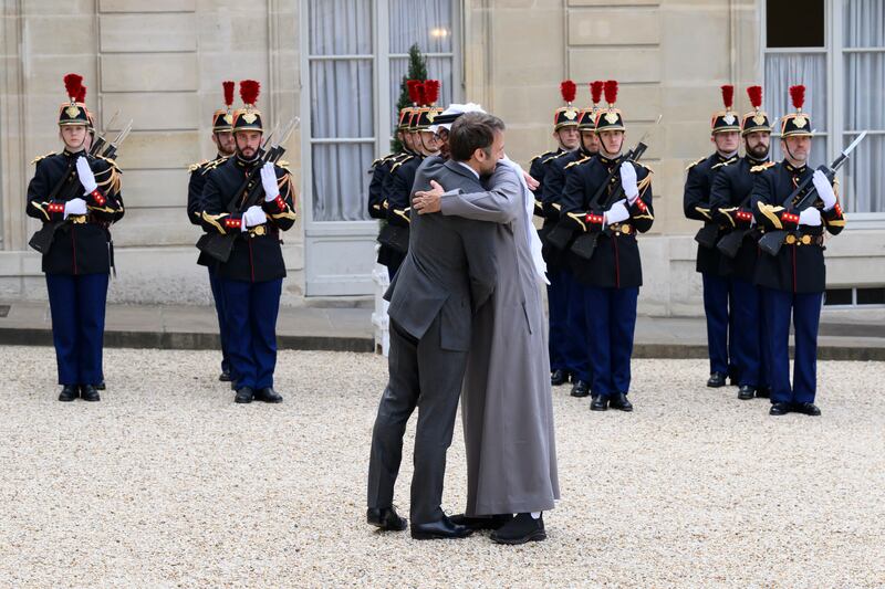 Sheikh Mohamed and Mr Macron embrace