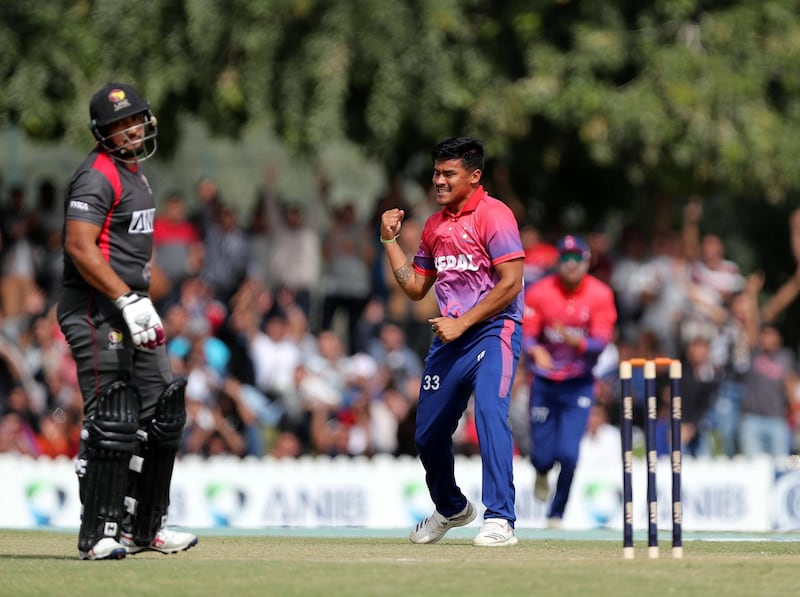 Dubai, United Arab Emirates - January 25, 2019: Karan KC of Nepal takes the wicket of Ashfaq Ahmed of the UAE in the the match between the UAE and Nepal in a one day internationl. Friday, January 25th, 2019 at ICC, Dubai. Chris Whiteoak/The National