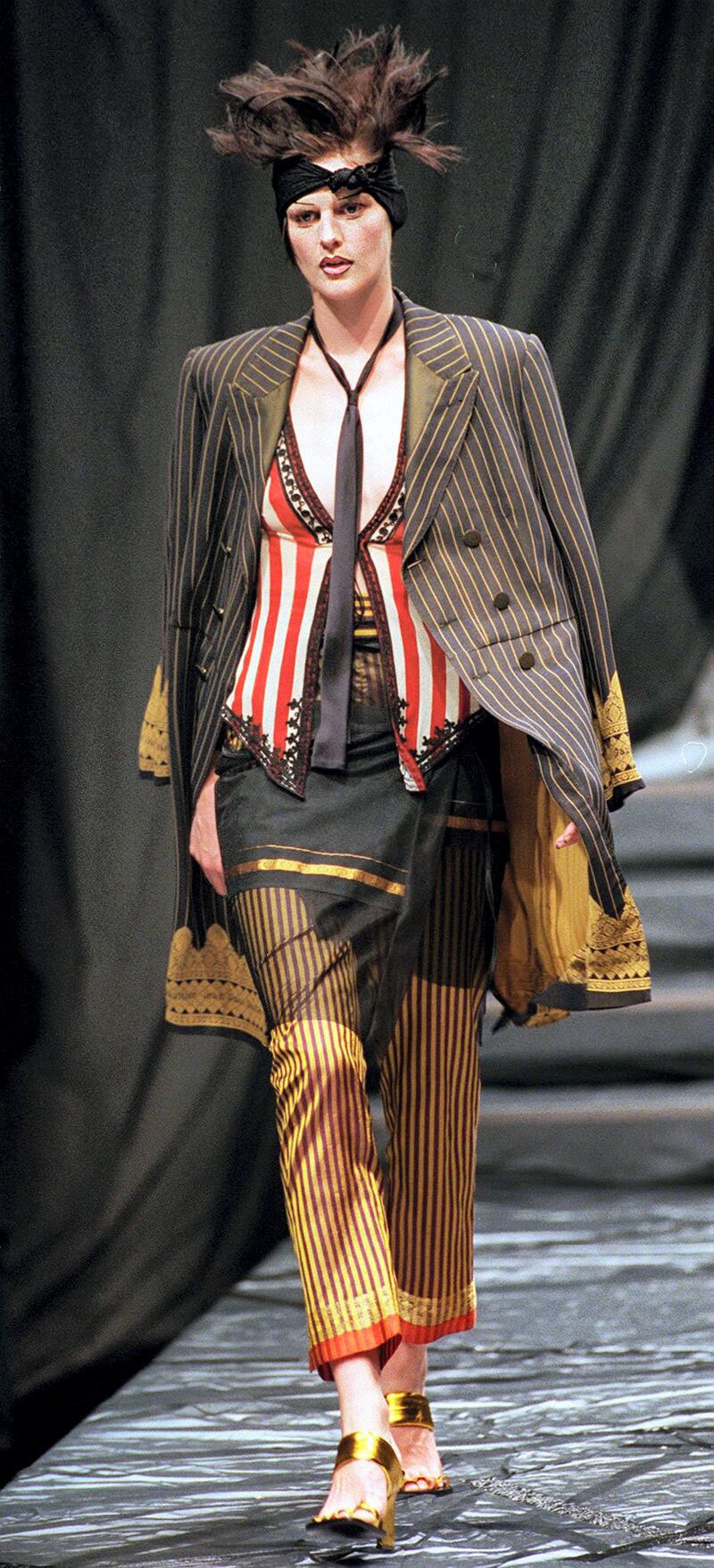 British model Stella Tennant for French designer Jean-Paul Gaultier presents this black and yellow striped jacket over striped trousers with red,white and black striped waist coat as part of his 1997 Spring/Summer ready-to-wear fashion collection October 11.The Paris fashion season runs through next week.

FRANCE FASHION