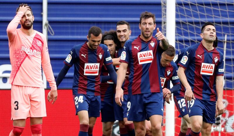 Eibar players celebrate after scoring the 2-2 tie againts FC Barcelona. EPA