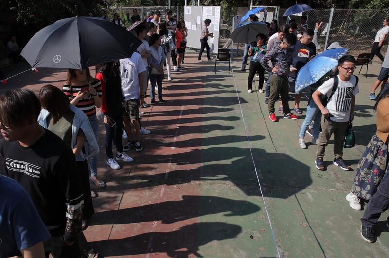 Long lines snaked around plazas and extended for blocks as Hong Kong citizens waited for their turn to vote. AP Photo