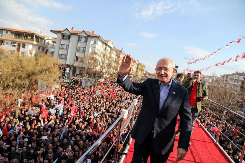 Turkey's main opposition Republican People's Party (CHP) leader Kemal Kilicdaroglu, left, waves in front of his supporters during an election campaign rally in Ankara ahead of the March 31 local elections.    AFP