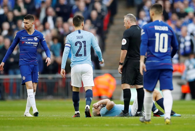 Sergio Aguero lies on the ground after his clash with Jorginho. Action Images via Reuters