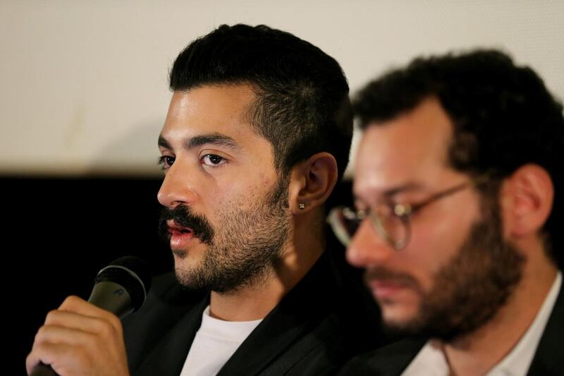 Lebanese Hamed Sinno, left, the lead singer and song writer of the Lebanese group Mashrou' Leila. A Jordanian ban on the group performing in the country was lifted, but not in time for the group to travel to the concert. Hussein Malla / AP Photo