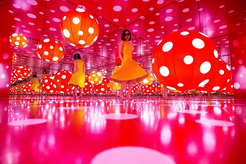 Sharjah, United Arab Emirates, January 9, 2017:    Thanita Denkaew an expatriate from Thailand spins inside the Dot Obsessions installation by Japanese artist Yayoi Kusama at Sharjah Art Foundation in the Heart of Sharjah area of Sharjah on January 9, 2017. Christopher Pike / The National

Job ID: 
Reporter:  N/A
Section: News
Keywords: POSSIBLE FOCAL POINT *** Local Caption ***  CP0109-na-stand alone02.JPG