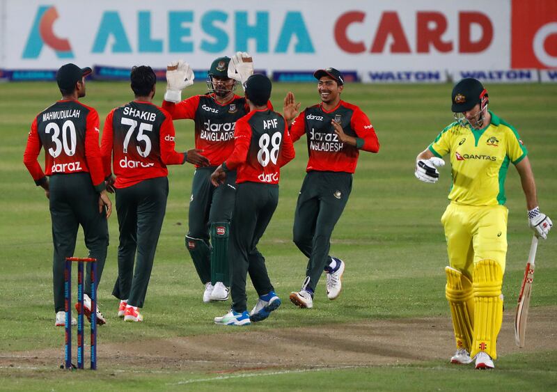 Bangladesh's Shakib Al Hasan celebrates with his teammates after taking the wicket of Australia's Moises Henriques.