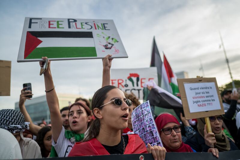 Supporters of the Palestinian people demonstrate outside the United Nations offices in Geneva, Switzerland. AFP