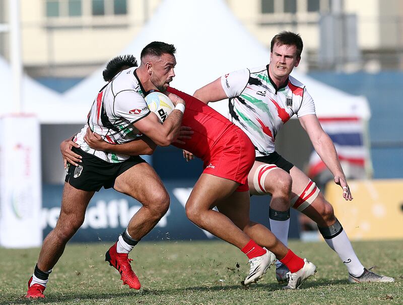 UAE's Ethan Matthews, left, during the national team's 29-17 loss to China in the Dialog Asia Rugby Sevens Series at Rugby Park in Dubai Sports City.