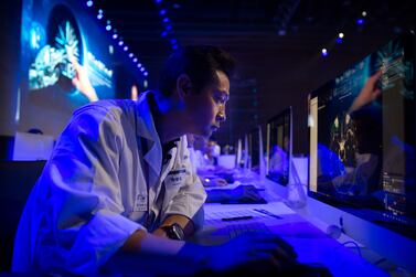 A doctor examines a magnetic resonance image of a human brain during the CHAIN Cup at the China National Convention Center in Beijing, Saturday, June 30, 2018. A computer running artificial intelligence software defeated two teams of human doctors in accurately recognizing maladies in magnetic resonance images on Saturday, in a contest that was billed as the world's first competition in neuroimaging between AI and human experts. (AP Photo/Mark Schiefelbein)