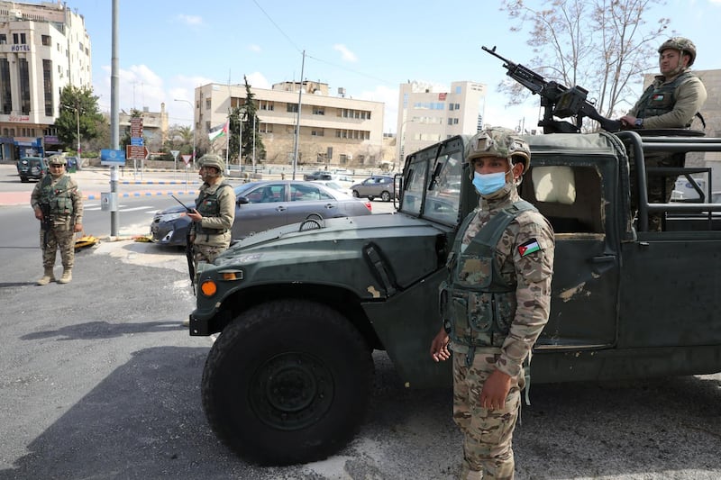 Jordanian army members stand guard outside a hotel transformed into a quarantine station amid concerns over the coronavirus in Amman. Reuters