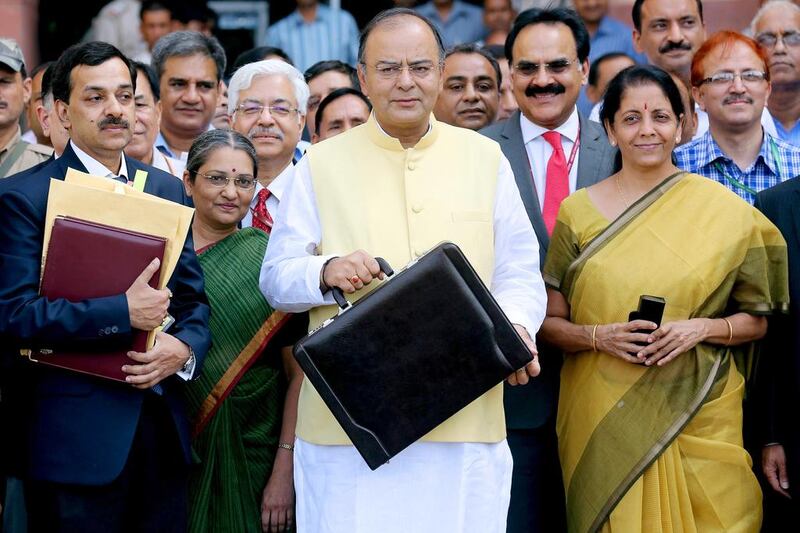Indian finance minister Arun Jaitley, centre, and minister of state for finance corporate affairs Nirmala Sitharaman, right. Money Sharma / EPA