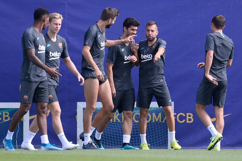 Barcelona players share a joke. AFP
