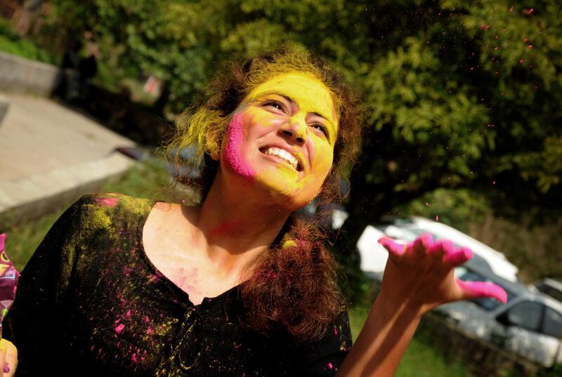 Indian students from Guru Nanak Dev University take part in Holi festival celebrations at the university campus in Amritsar, India. EPA