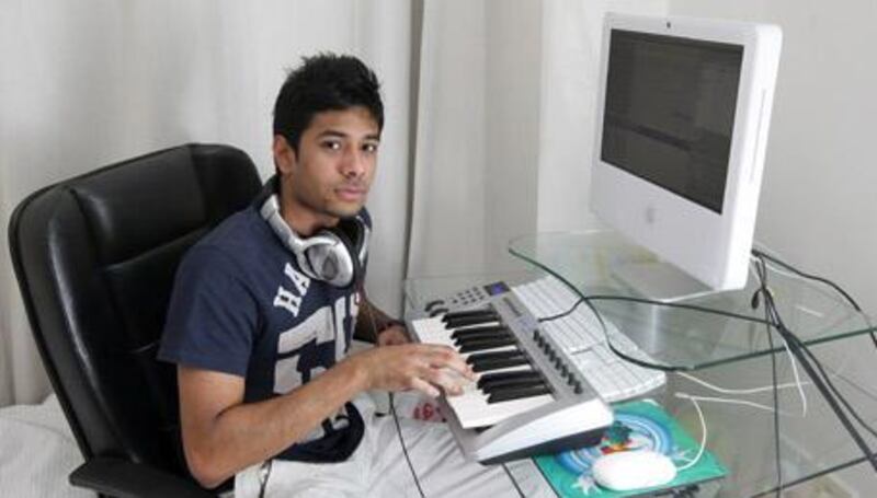 Jason Zamanat, one half of Charistmatic Flow Productions, at work in his home studio .